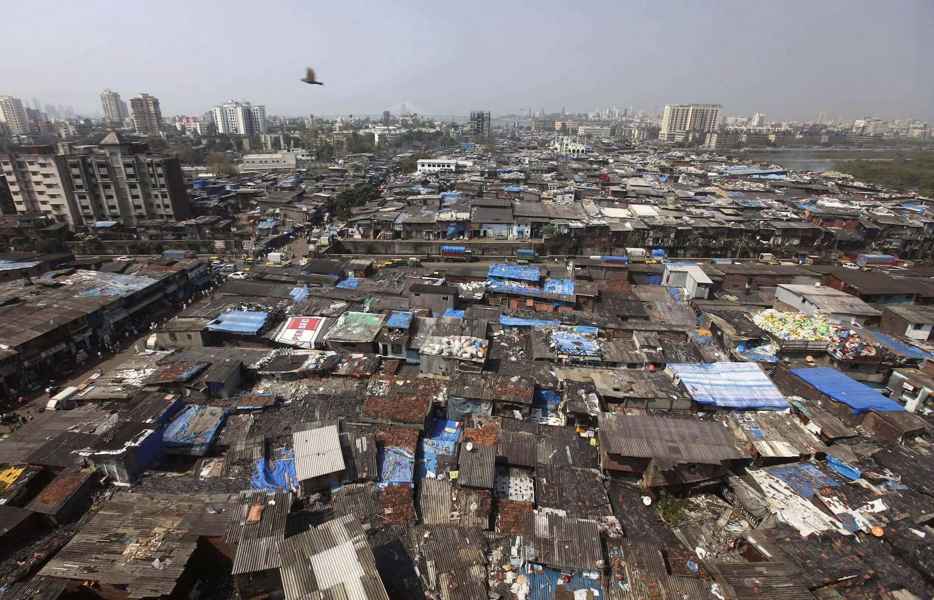 An aerial photo of the slums of Mumbai stretching far into the distance.